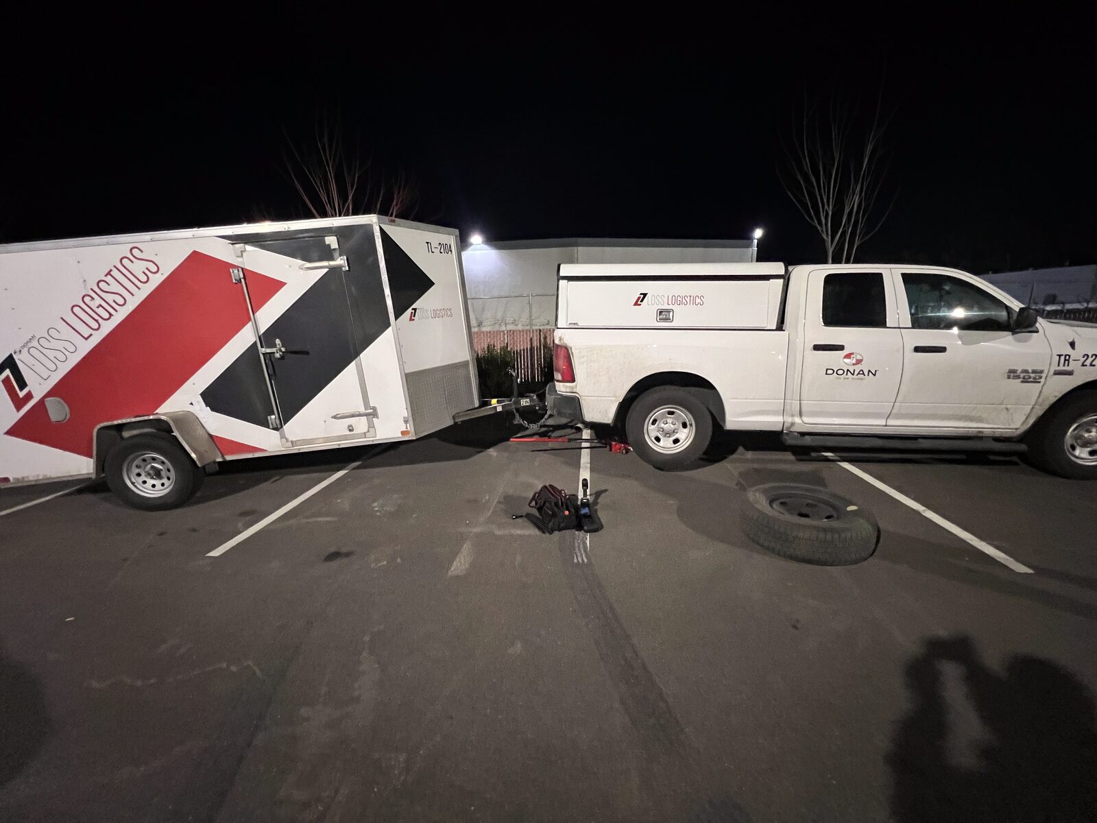 CB Roadside servicing a box truck and pickup at night
